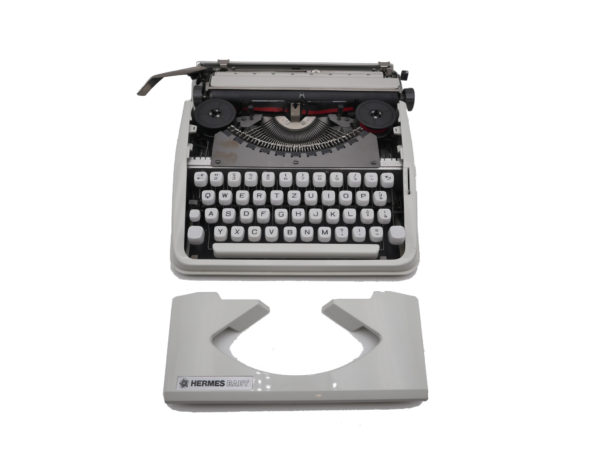 Machine à écrire Hermes baby blanche qwertz suisse révisée ruban neuf