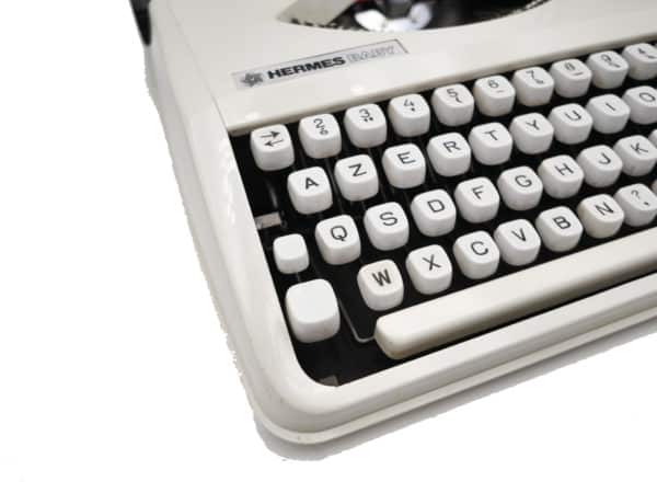 Machine à écrire Hermes Baby Beige Cursive révisée ruban neuf
