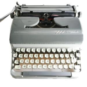 Machine à écrire vintage grise révisée ruban neuf Torpedo 18S